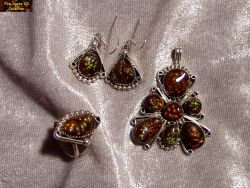 Small Picture 1 DCJ001 Sterling silver fire agate jewelry set consisting of a ring, pendent and earrings shown on a velvet background
