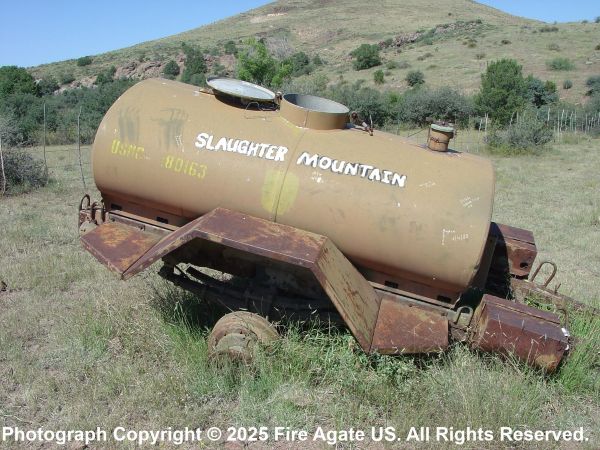 A water tank located at Slaughter Mountain Fire which has been painted with the words Slaughter Mountain
